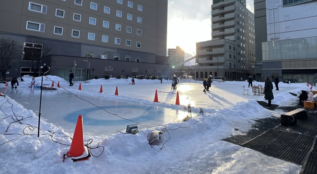 Volunteers preparing the outdoor rink at Tokachi Ice Park Plus
